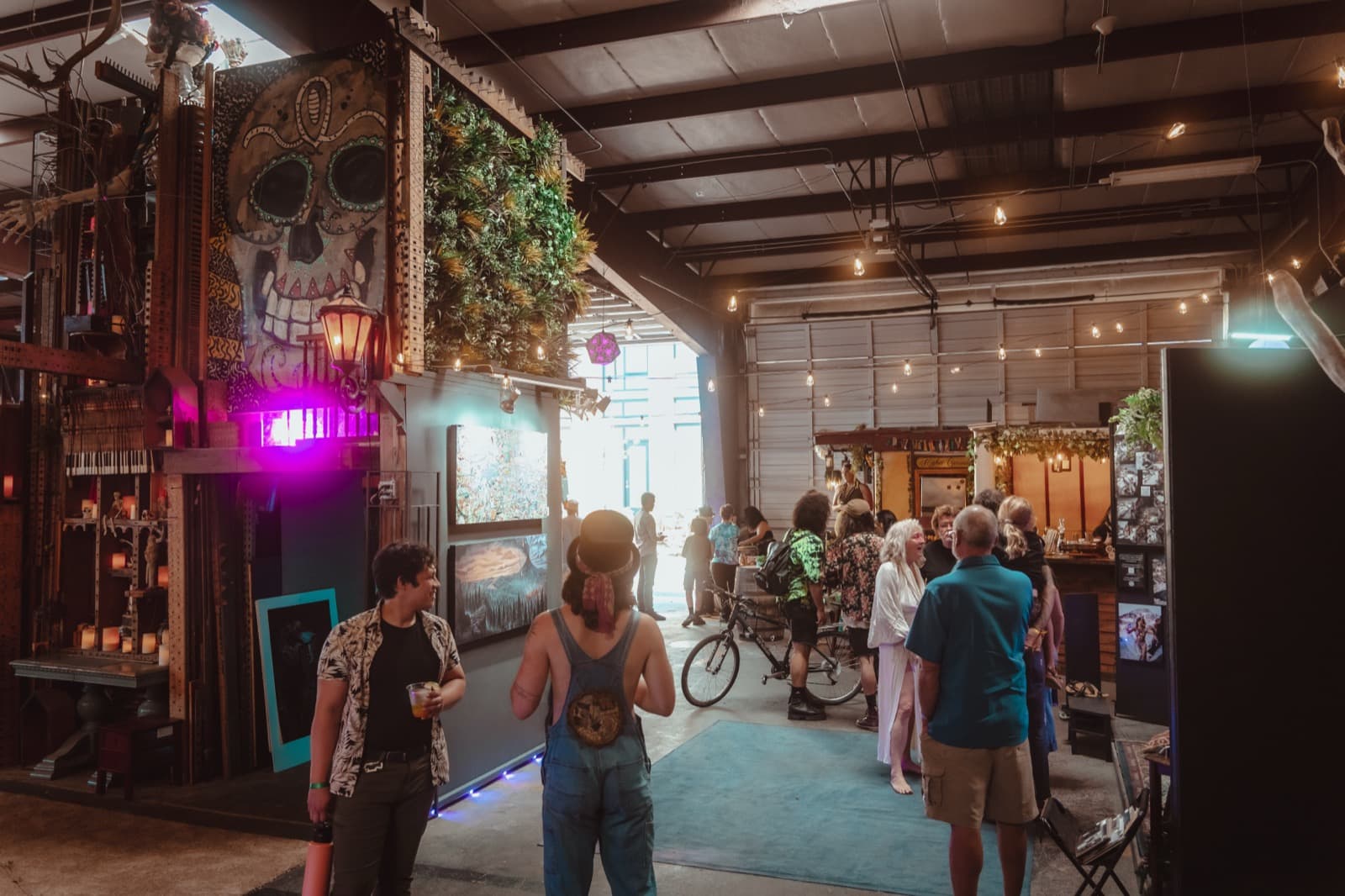 Visitors walking through the plant-filled main corridor of The Haven PDX