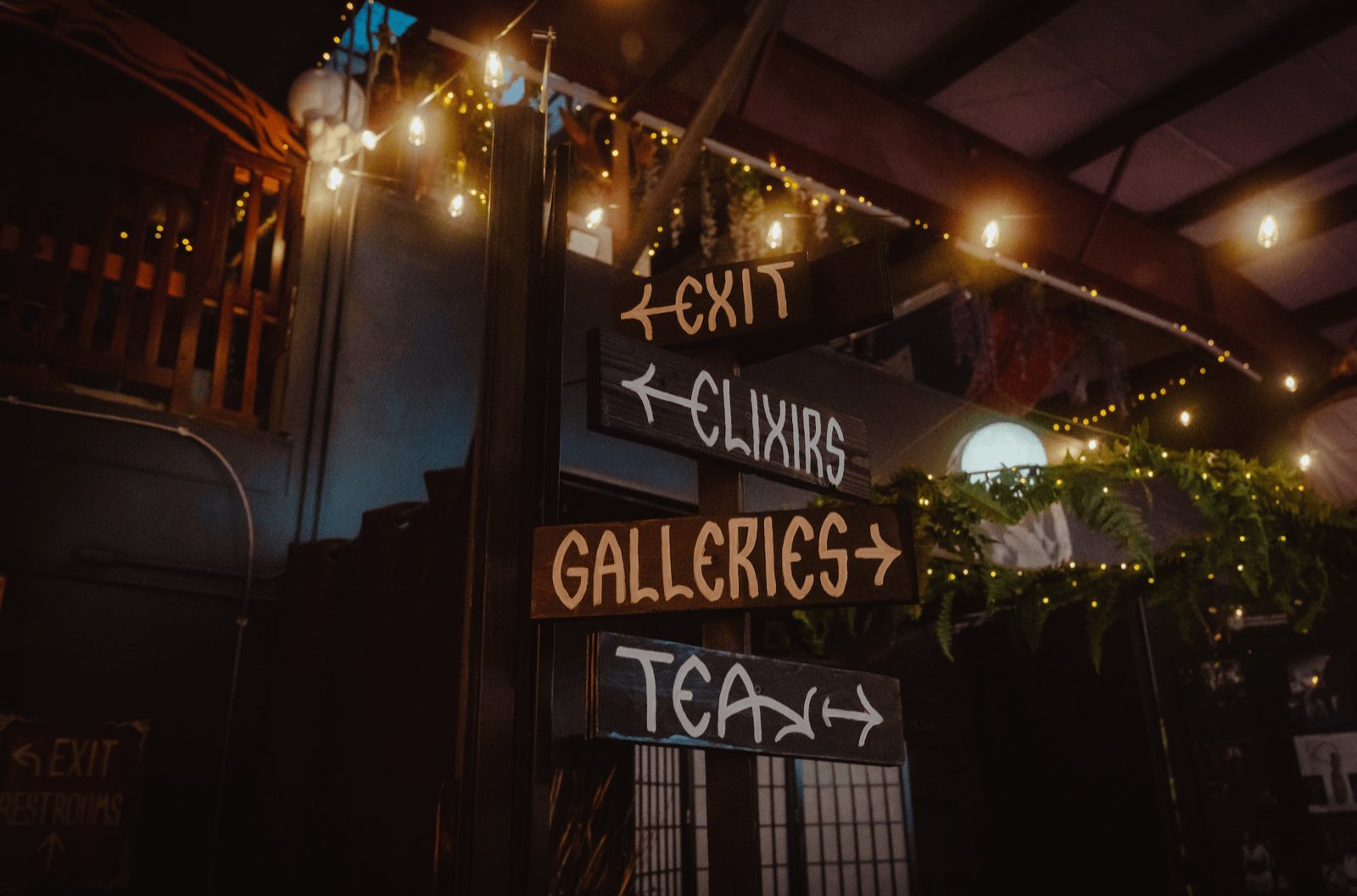 Hand-painted signs above the main hall pointing to the galleries