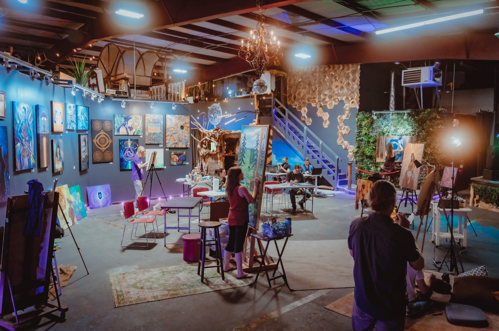 The open studio floor at The Haven with people working and talking